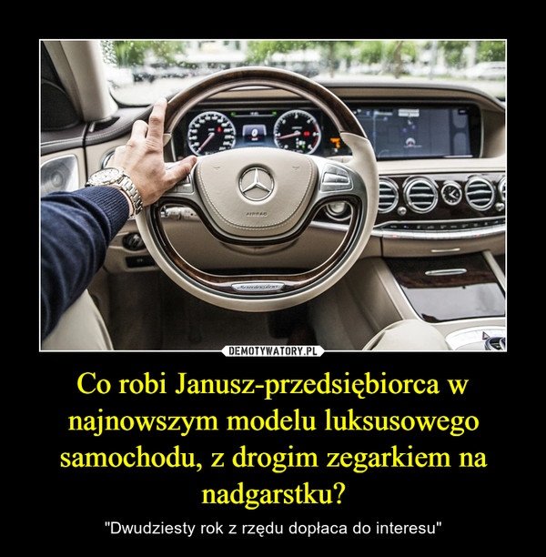 Co robi Janusz-przedsiębiorca w najnowszym modelu luksusowego samochodu, z drogim zegarkiem na nadgarstku?